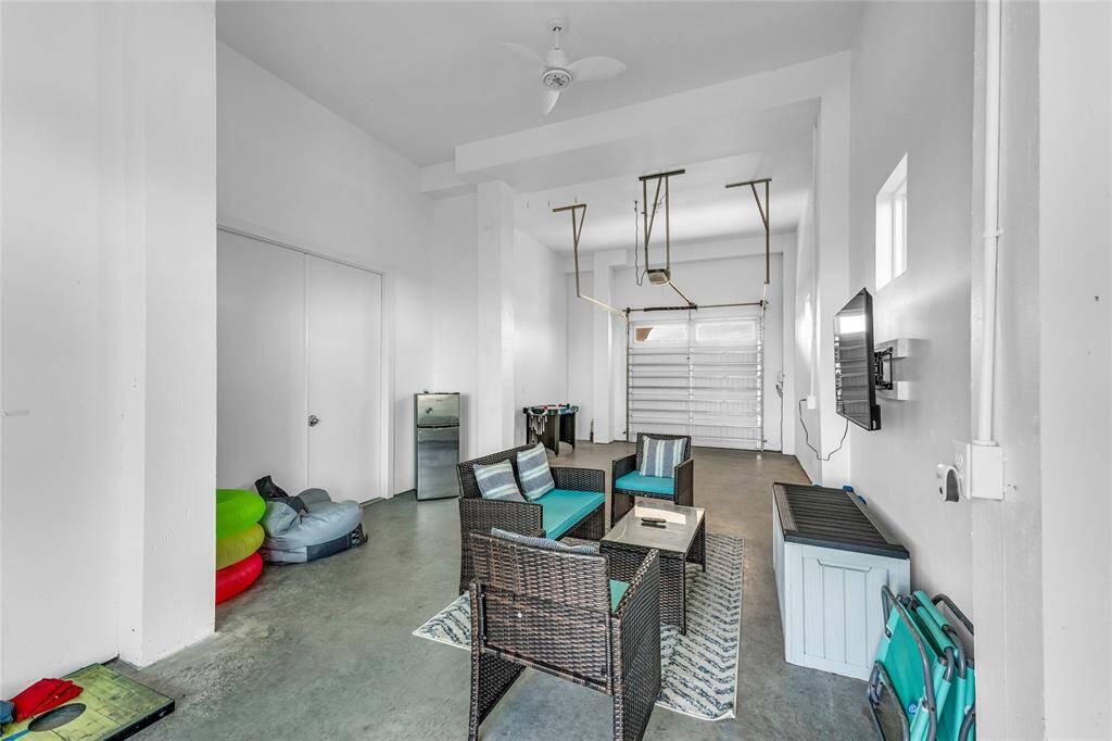 First floor garage. Gameroom, storage room, golf cart parking!