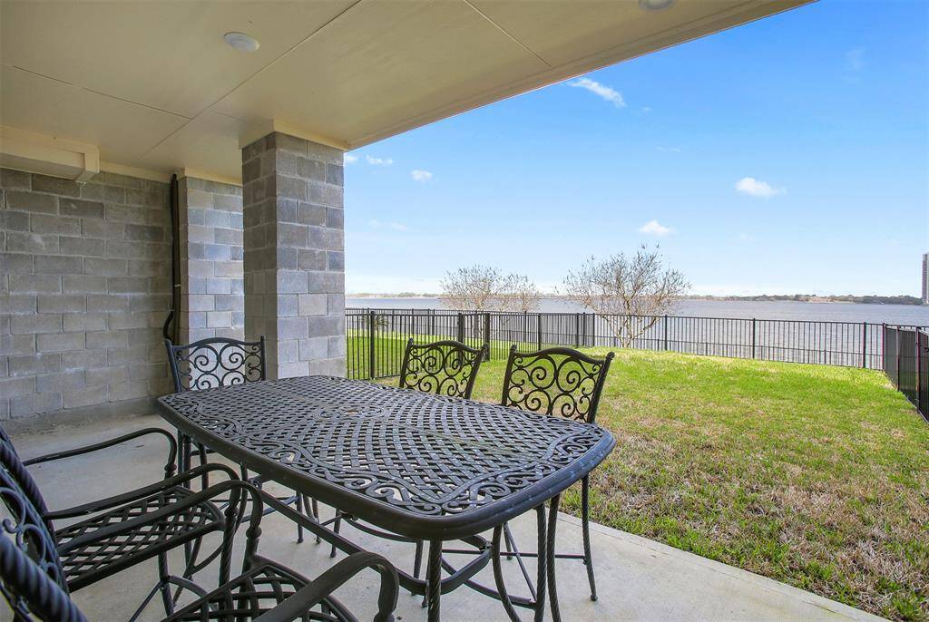 Covered back patio with waterview
