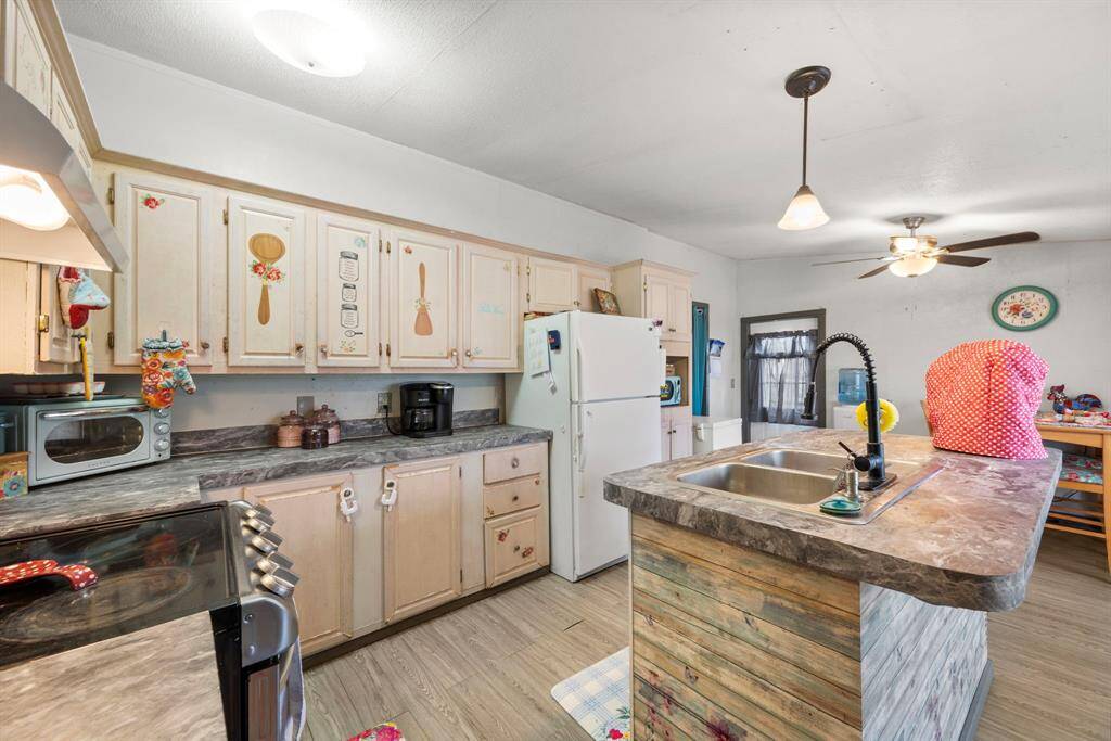 This kitchen is EVERYTHING! Complete with an island and tons of cabinet space
