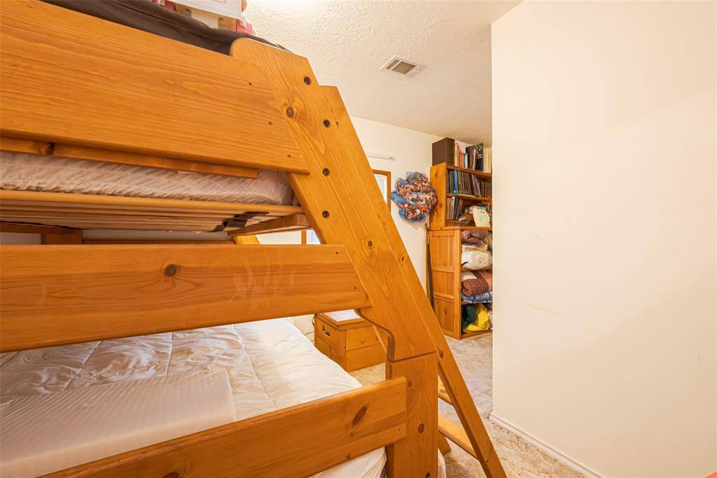 This secondary bedroom is an "L" shaped room.
