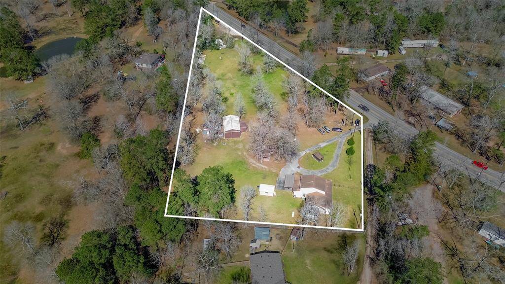 See it all in this view.  Lots of FM 1485 road frontage. Large storage shed to the left of the house and huge 24'x36' barn.