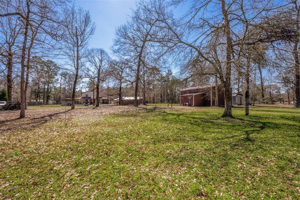 2.43 UNRESTRICTED acres with a 24'x36' barn and a large storage shed.