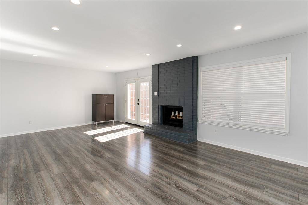 Expansive family room with beautiful flooring.
