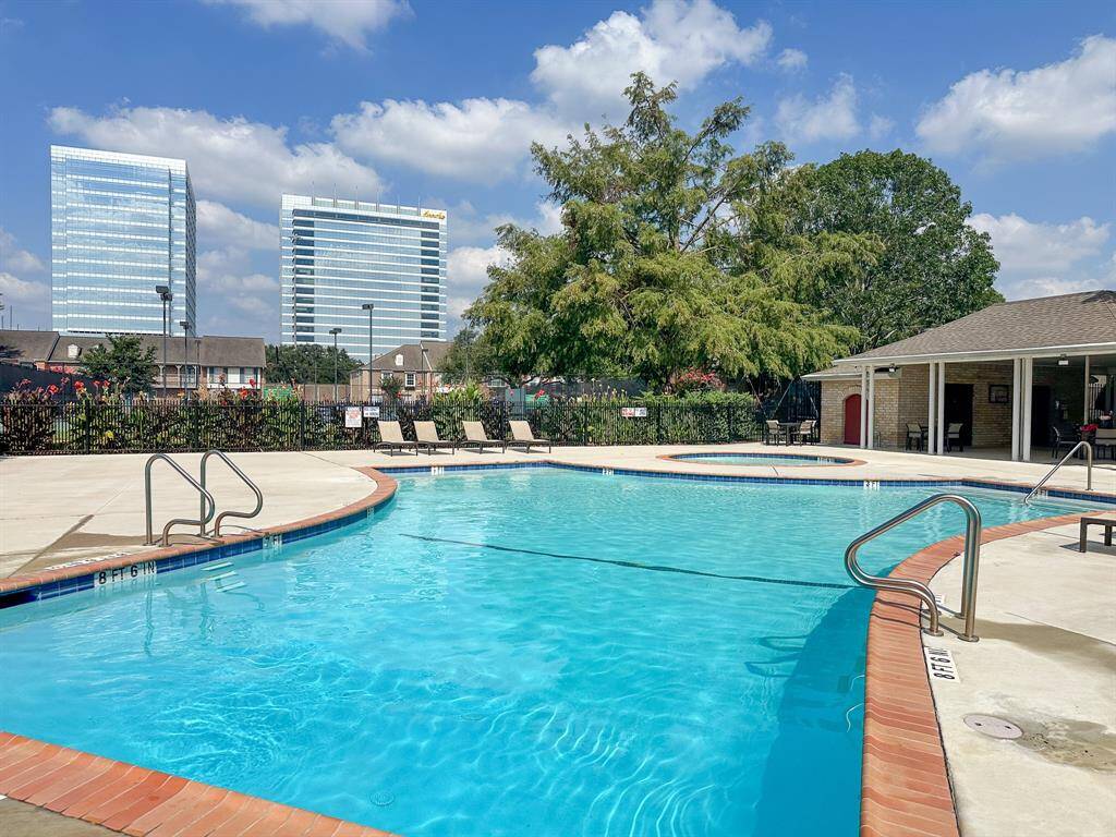 Relaxing pool area with nice views of the city landscape.