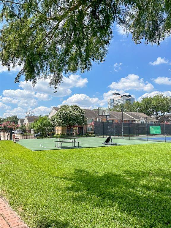 Tennis court, basket ball hoop and pickle ball.