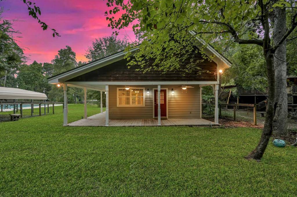 Pool house with large porch and outdoor living!