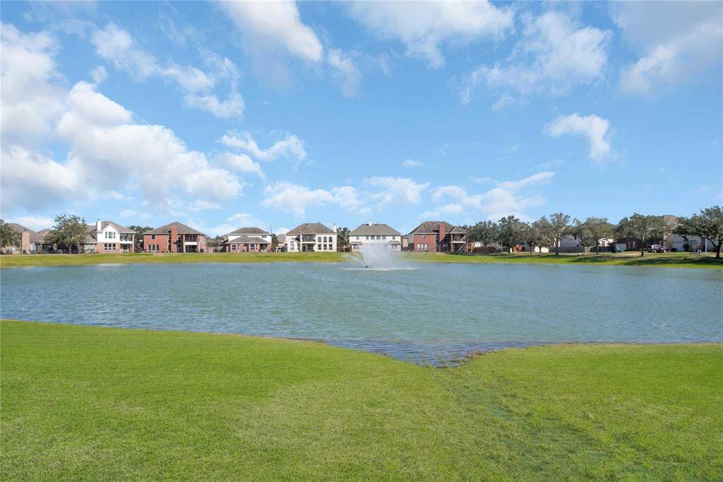 Peaceful neighborhood has walking trails and ponds to enjoy.