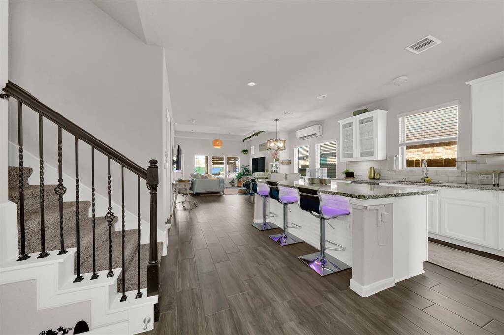 View off entryway of kitchen and open dining space
