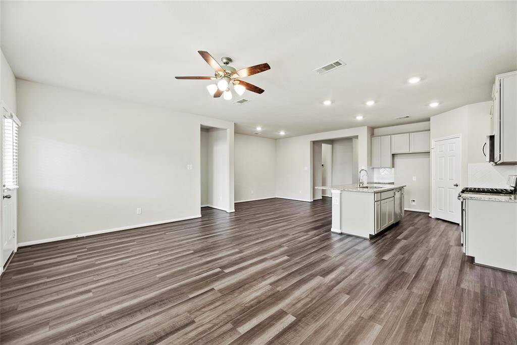 A large living area with a comfortable and inviting feel offers the perfect setting for relaxation and socializing.