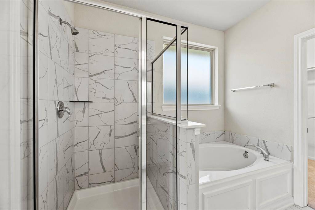 Unwind in your deep soaking tub or jump in the separate shower for a quick rinse.