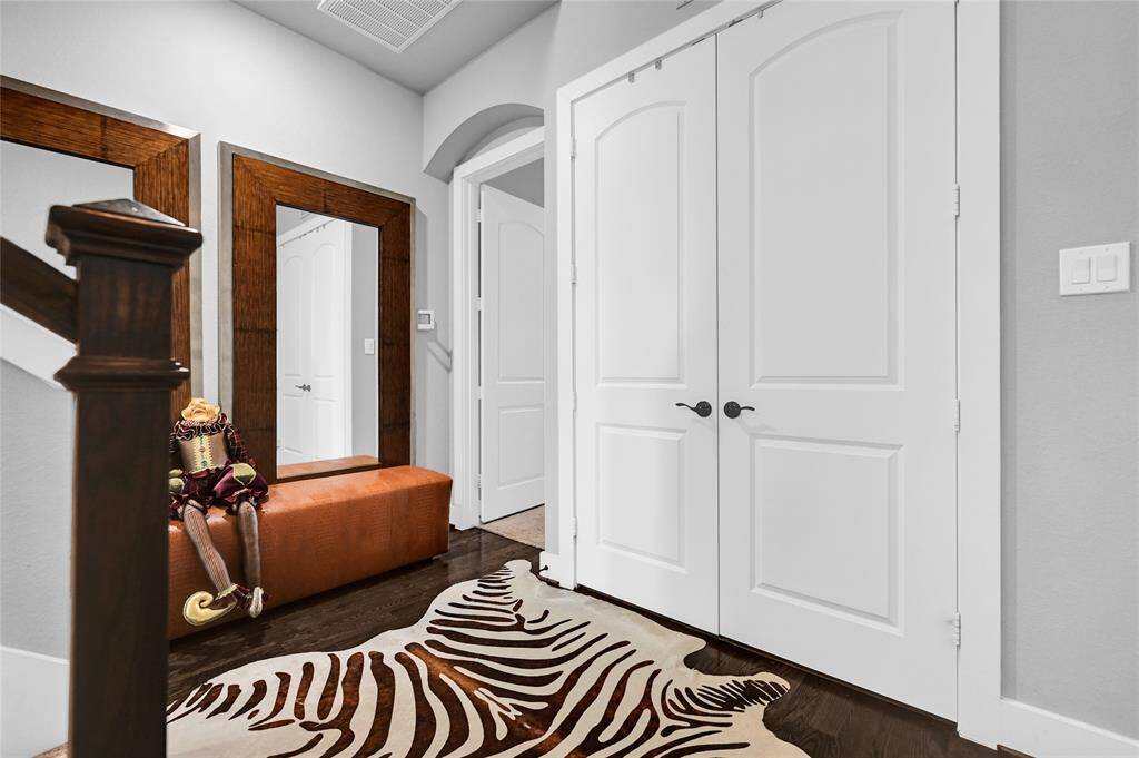 Another view of landing on third level, washer and dryer behind the double doors,