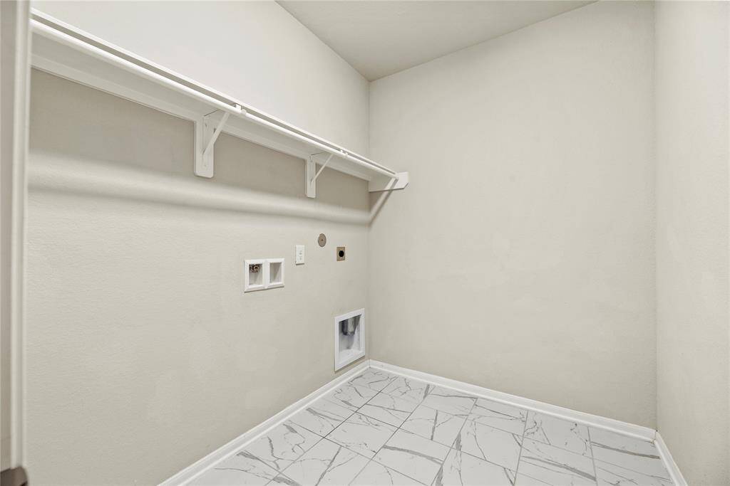 This well-appointed space includes ample storage and efficient organization, making laundry day a breeze while keeping your home tidy and functional.