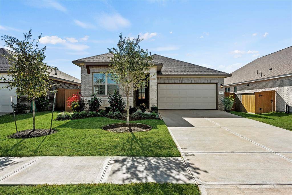 Beautiful stone and brick exterior has great street appeal along with professionally landscaped pathway to the front door.