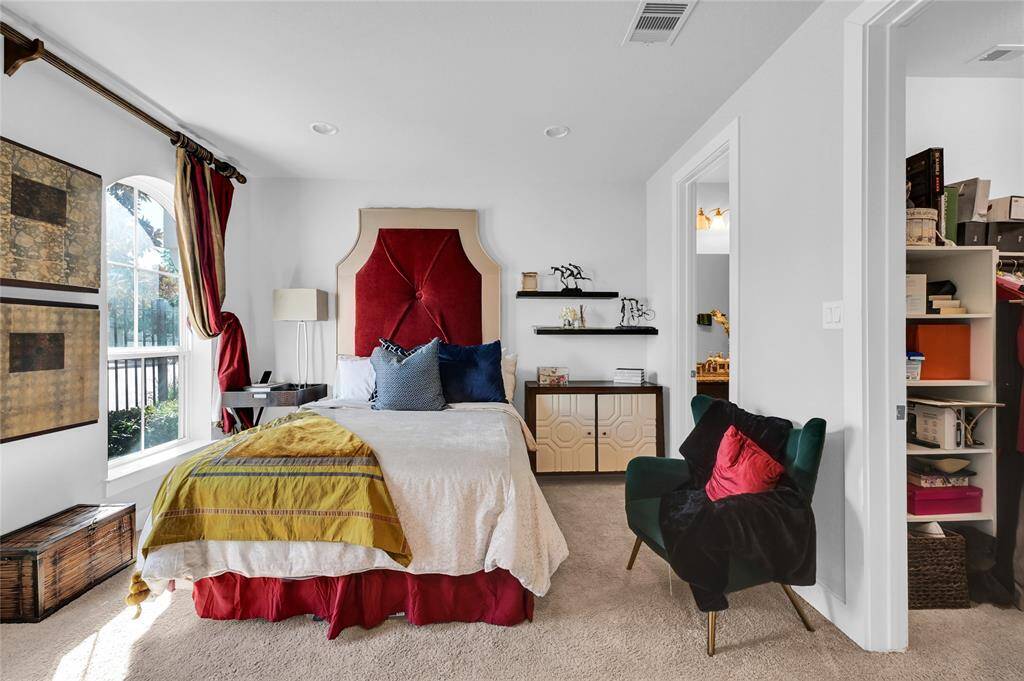 First floor bedroom with two large windows.