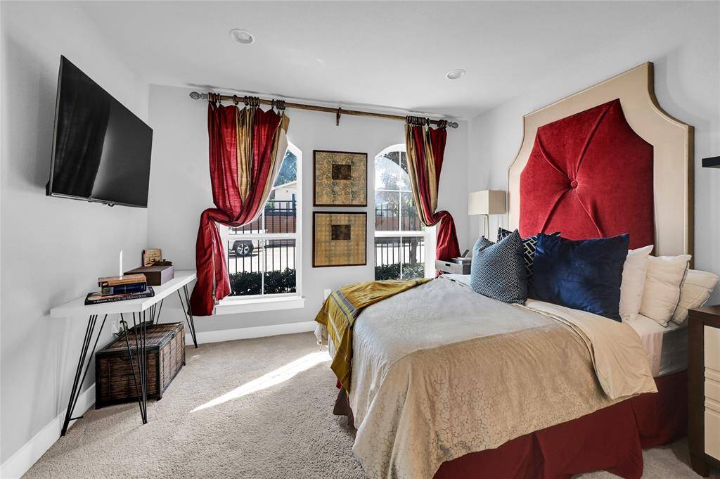 First floor bedroom with large windows and en-suite bathroom.