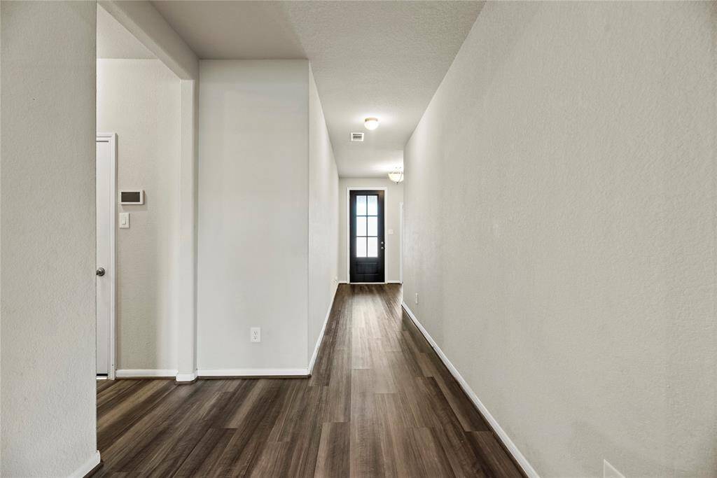 The moment you step in you feel a beautiful calming sense from this home, with it's light and airy vinly wood plank flooring.