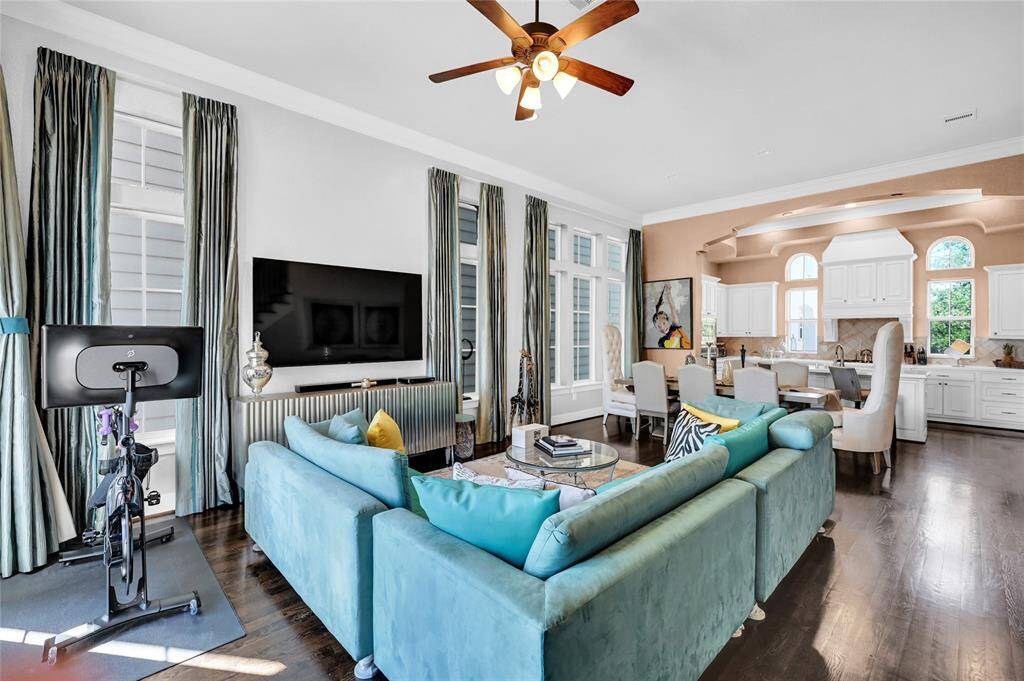Great Room with high celings. Generous space throughout the home!!  Second level family room overlooking kitchen.  There is a spacioius patio on this level as well.
