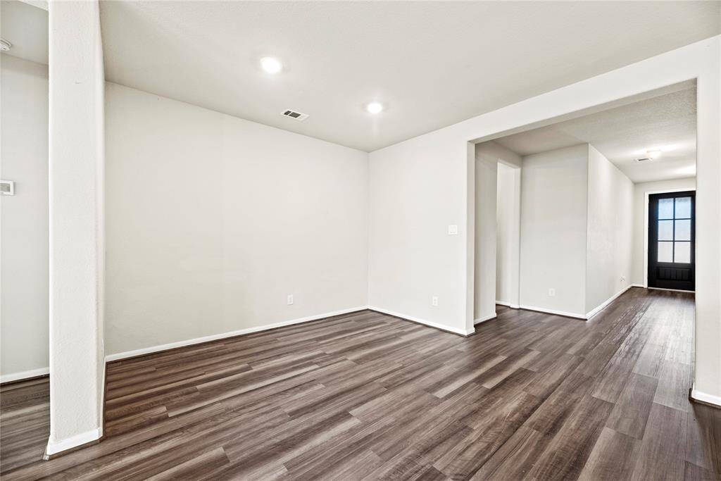 This spacious dining area is perfect for entertaining and will accommodate a large table for family and guests.