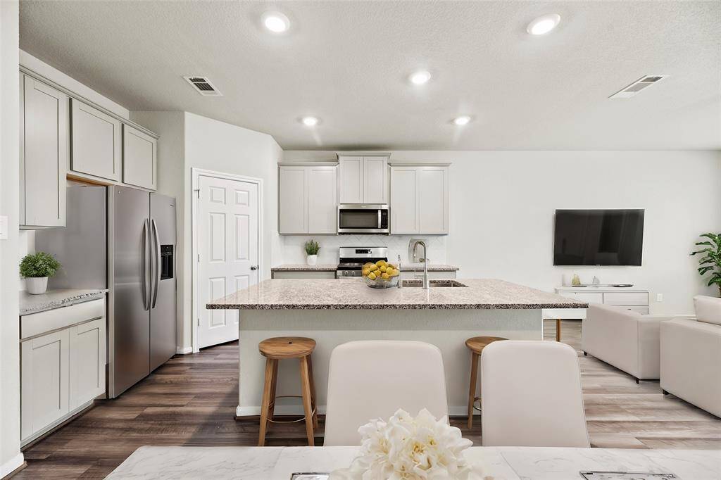 The open feel of the home, where the kitchen, dining area, and living room flow together seamlessly, is absolutely wonderful!