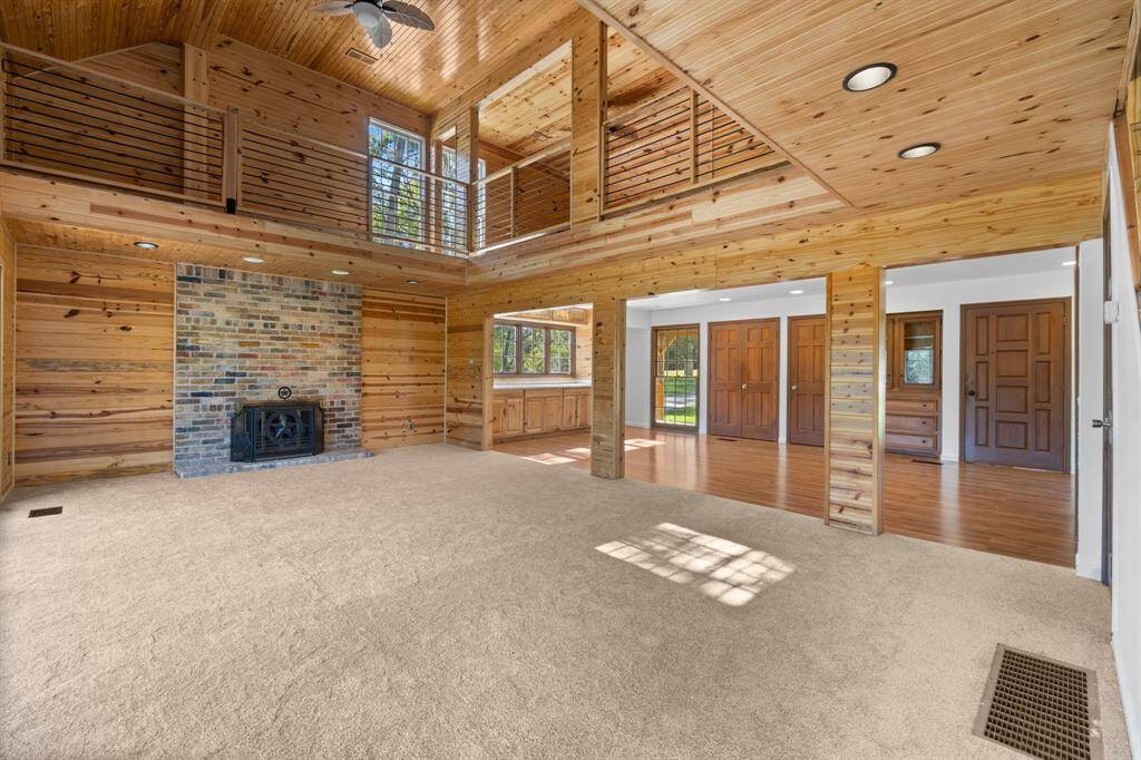 Family room on the second floor open to the kitchenette. Great open concept with a visual of the 3rd floor game room.
