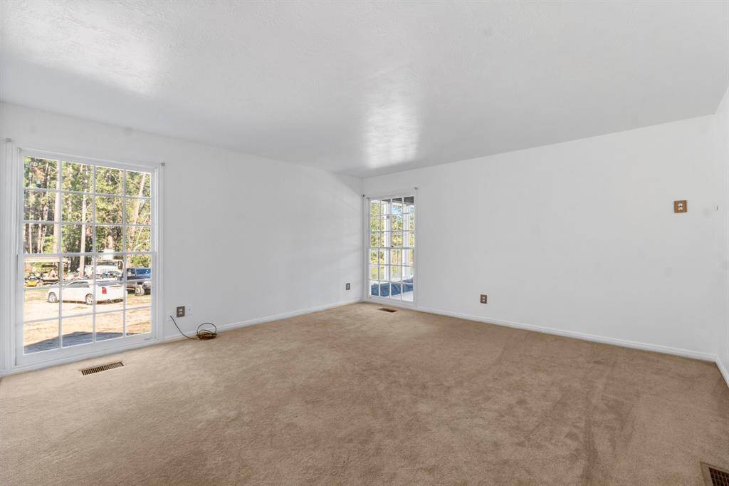 Another secondary bedroom on the 3rd floor. Lot next door will be cleared off. It is owned by the seller.
