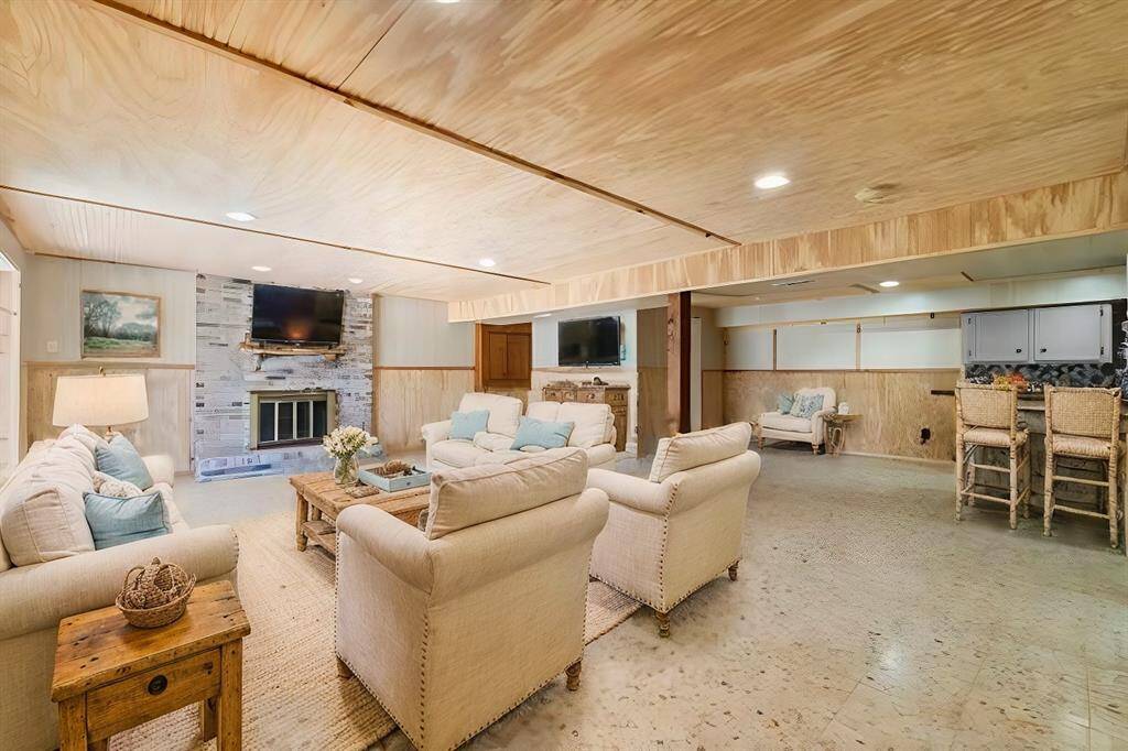 Virtually staged 1st floor living room with kitchen and full bathroom