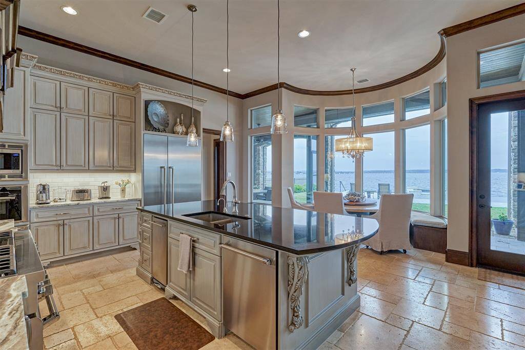 The center island provides an abundance of prep space for dinners, and entertaining, along with a dishwasher and trash compactor.