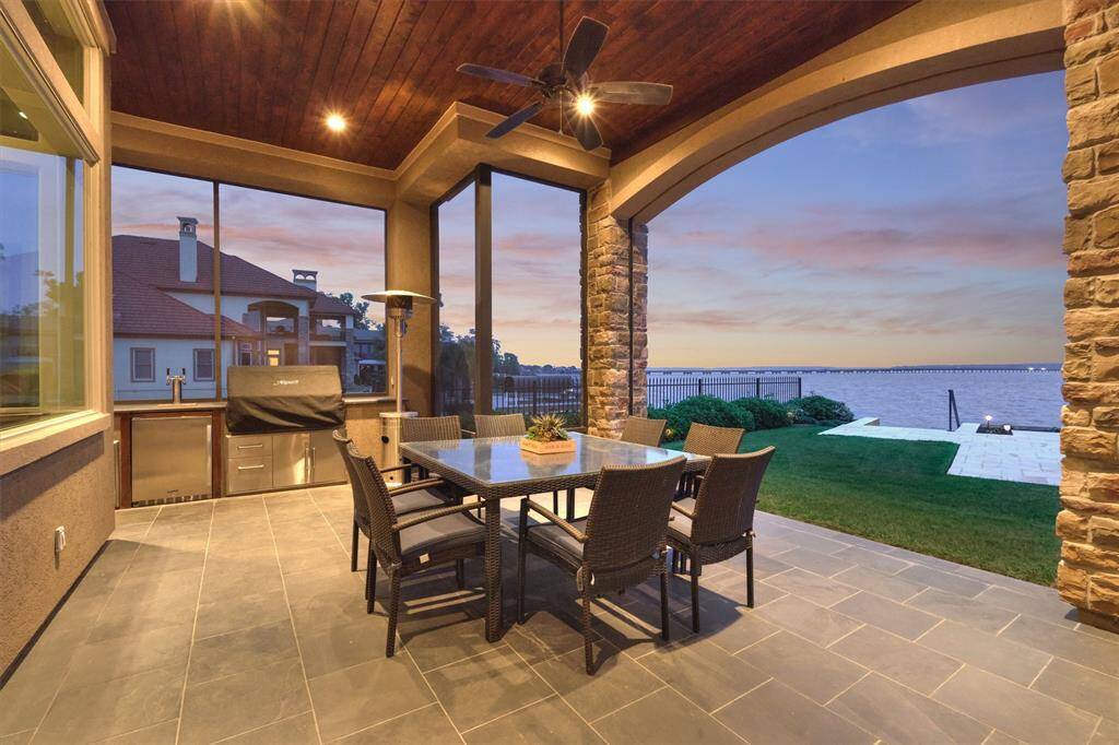 Take entertaining outdoors with a built-in outdoor kitchen! A cabana bath is just off of the kitchen and is accessible from outside.