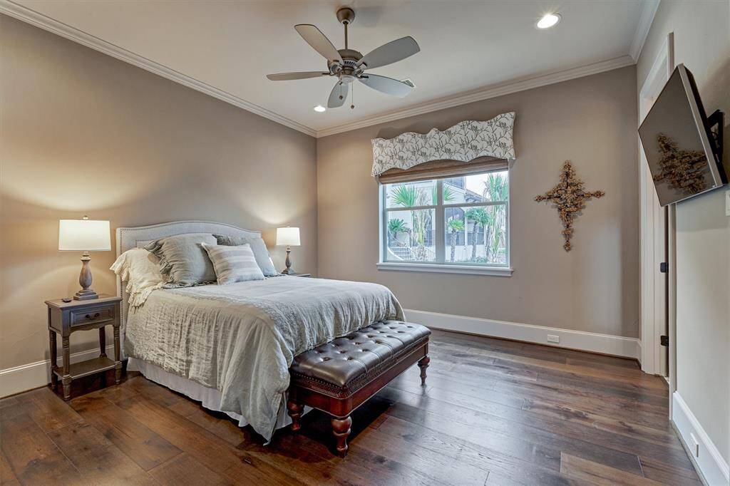 Also on the first floor is a beautiful guest bedroom with a large closet and ensuite bath. Notice the cleverly situated outlets on the base of the wall for a clean look.