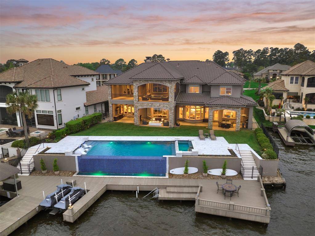 A 35' chlorine pool overlooks over 100' of waterfront shoreline on Lake Conroe! This home sits on over 1/2 an acre with enough grassy area for games and pets.