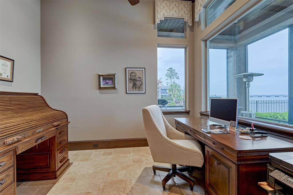 The first floor office has beautiful views of the lake and back yard.