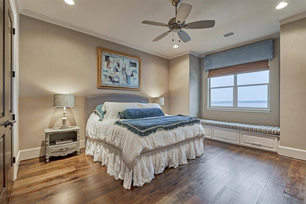 The third bedroom in the home has great water views, a large closet with built-in shelving and drawers and an ensuite bath w/ 2 sinks. A blackout shade blocks out light for a restful night of sleep.