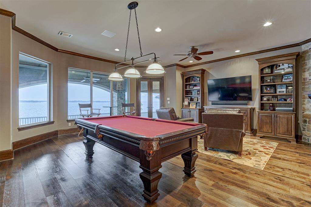 Enjoy unmatched views from the second floor game room with double glass doors leading to the oversized second floor balcony for additional living/entertaining space.