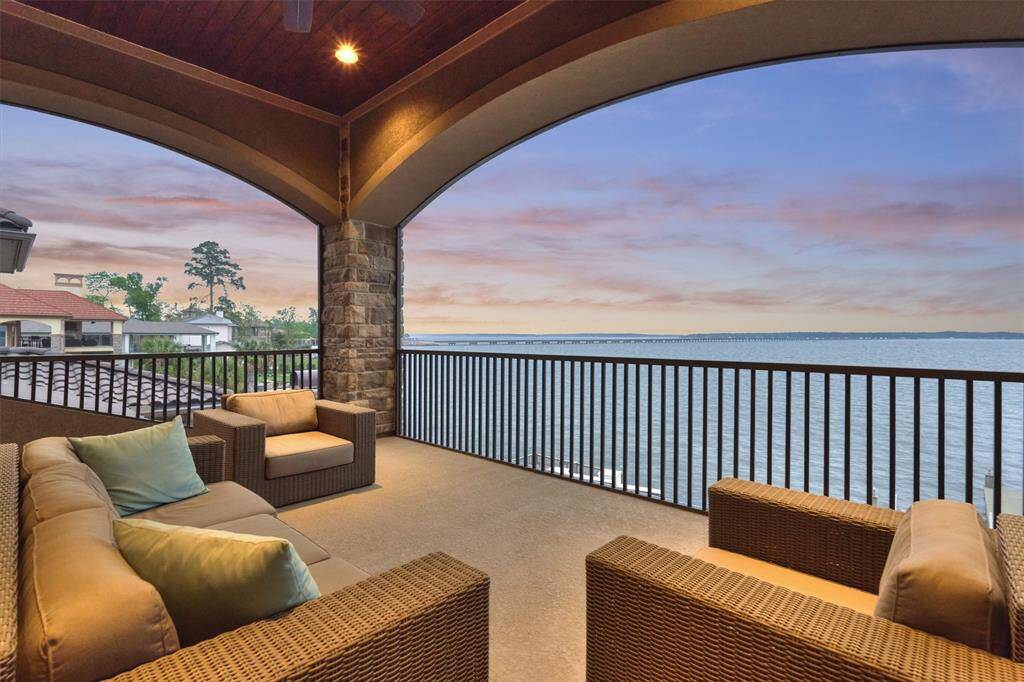 The second floor balcony offers a 180 degree view of Lake Conroe.