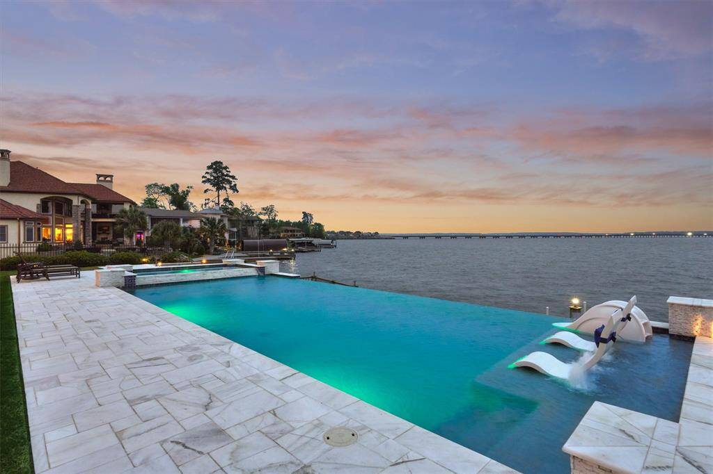 A view of the pool at night. Relax in the evenings taking advantage of this peaceful open water view.
