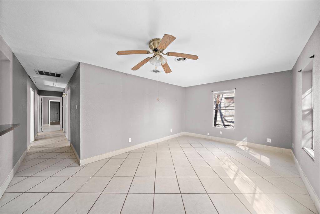 Living Room Opens Up To Kitchen With Bar