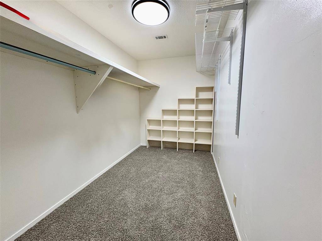 Primary Bedroom walk in closet