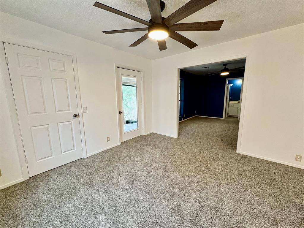 Gameroom view looking at back door to another Sun Room & Bedroom with Full Bath