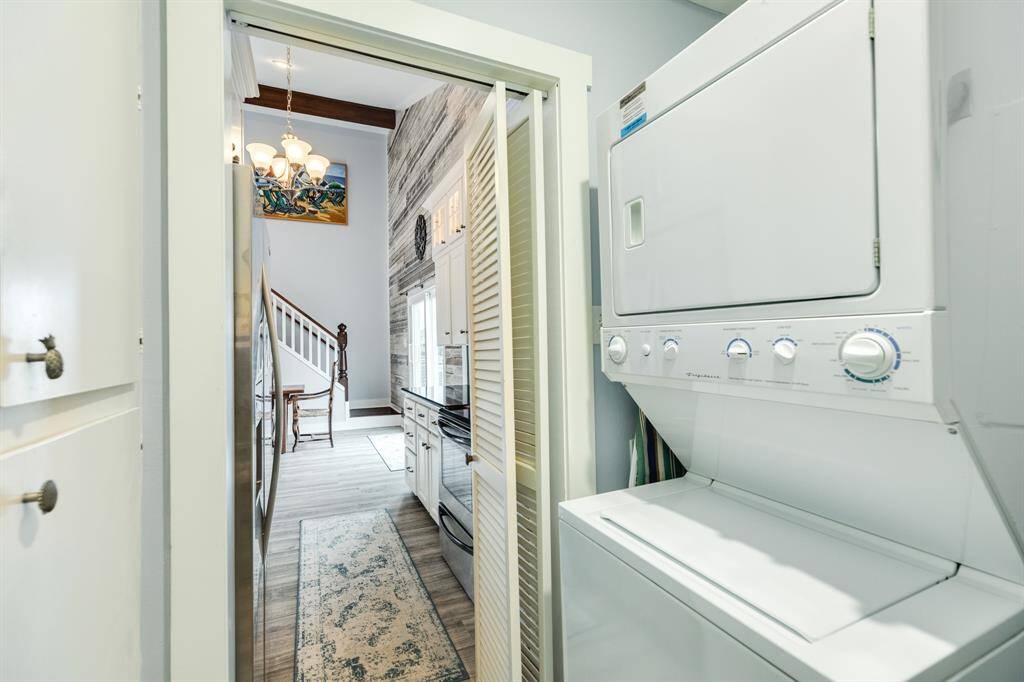 View from the utility/pantry storage room out through the kitchen.