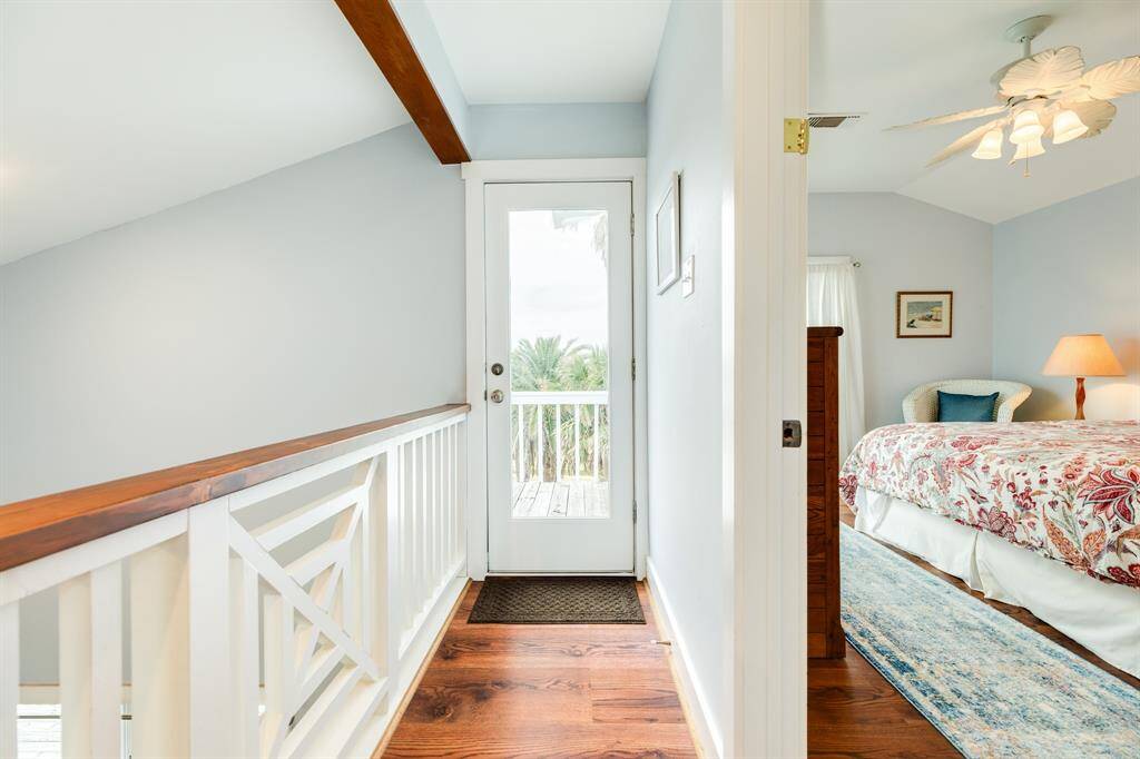 2nd floor hallway showing doorway out to private balcony area.