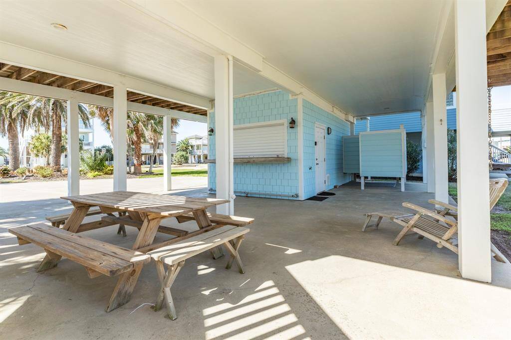 Another view of the patio area, tiki bar space and outdoor shower.