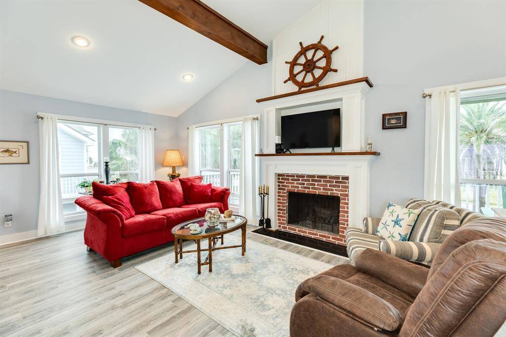 2nd view of the seating area in the living room. Again, window placements provide abundant natural light into the home.