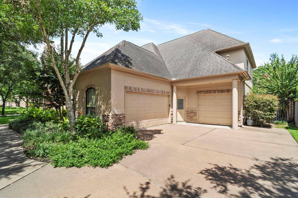 2 garages with covered parking for 3 cars.