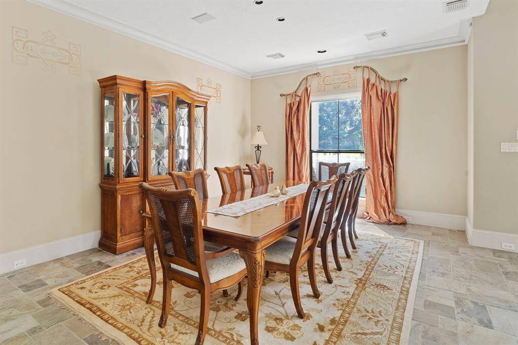 Spacious, open-plan dining room makes it easy to accommodate any size gathering.