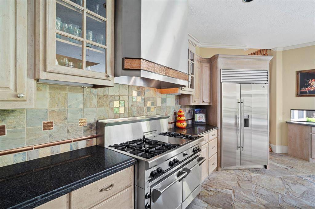 Top-of-the-line Wolf gas range with double convection ovens and 6-burner stovetop.