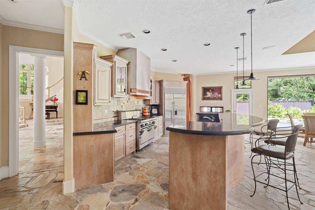 Enjoy easy access to the dining room and main living areas of the house from the centrally located kitchen.