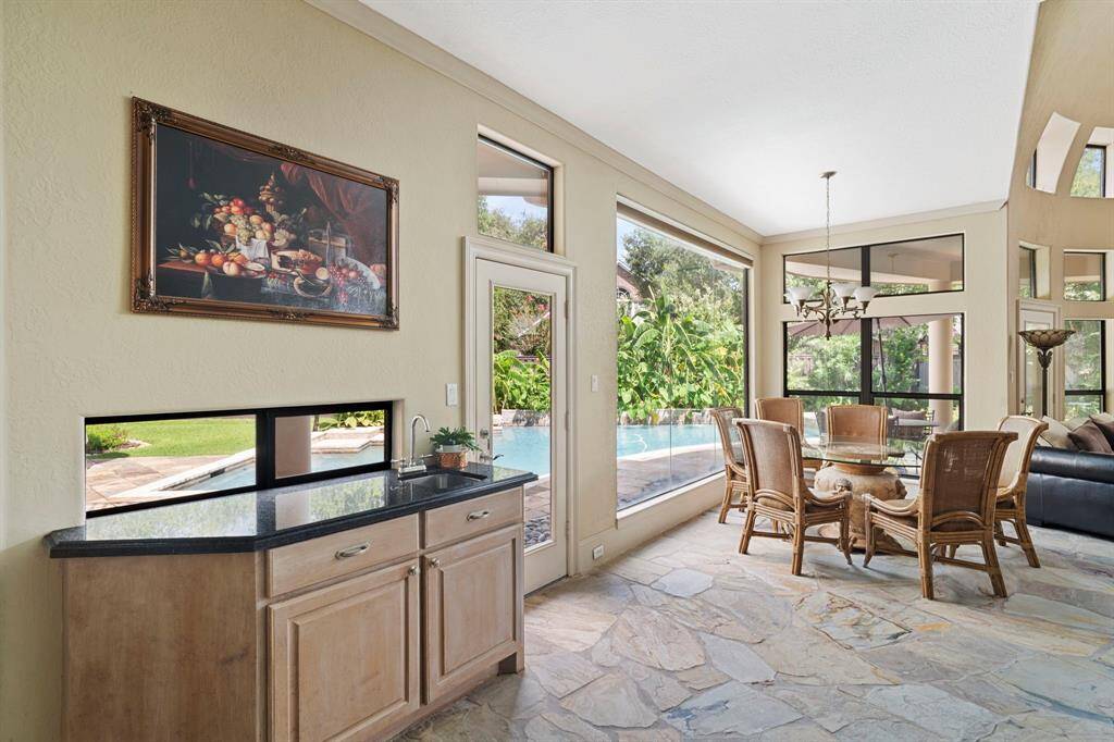 Beverage bar features letterbox windows that allow natural light and serve as a backsplash. Enjoy the view from the breakfast area!