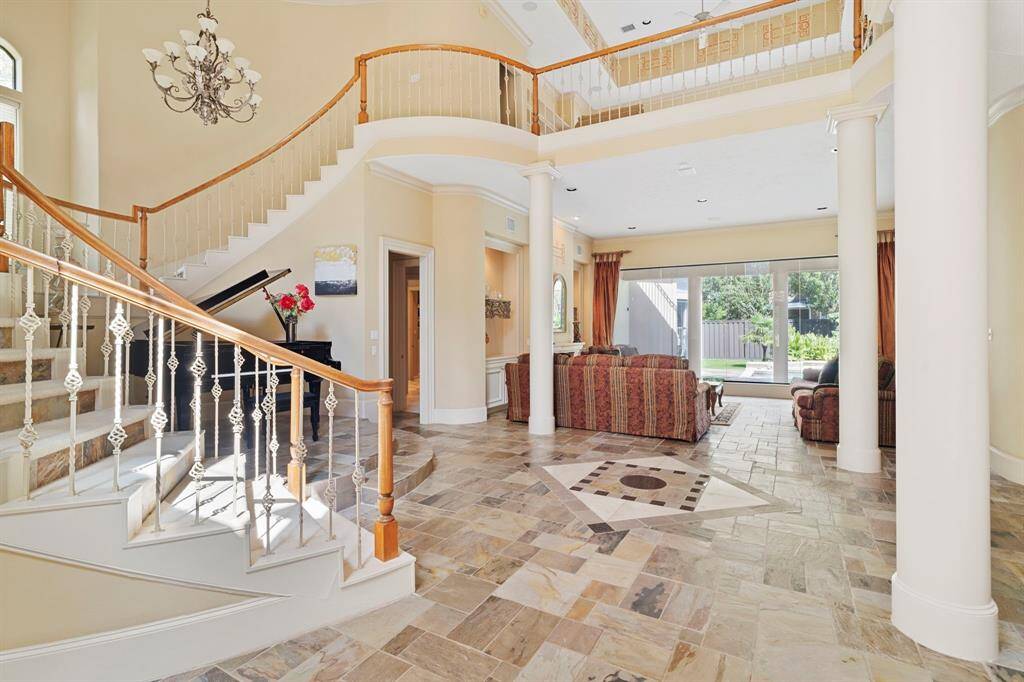 Spectacular curved, open staircase. Be sure to see if you can find the secret hidden room when you tour this home.