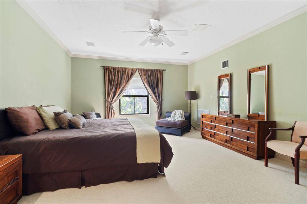 2 OWNER SUITES! This second floor suite features an en suite bathroom with dual vanity and 2 walk-in closets PLUS and additional 15' x 11' room that could be used for a children's playroom, home office, private den, or exercise room.