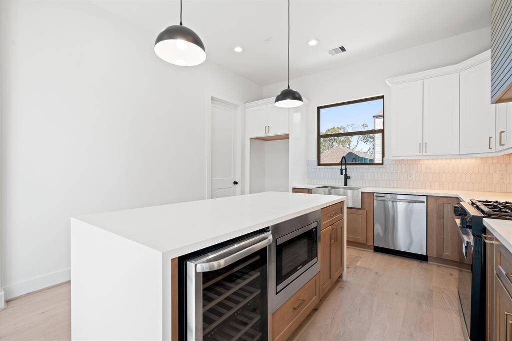Here's a peak at the kitchen of another home by the same builder. Different layout. Similar finishes.